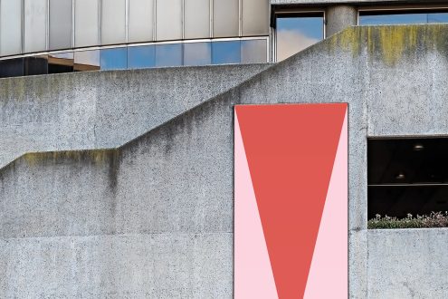 Urban billboard mockup on a concrete building with weathered textures for outdoor advertising designs display.