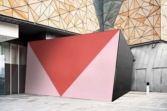 Modern building exterior with geometric facade and blank red wall mockup for marketing design presentations, urban architecture background.