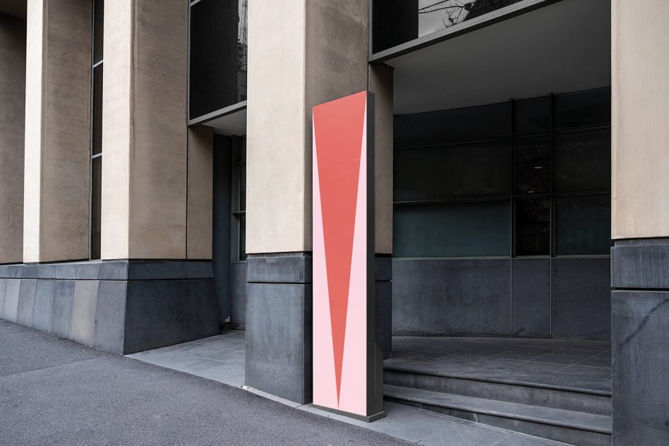 Coral geometric shape on concrete pillar in modern courtyard