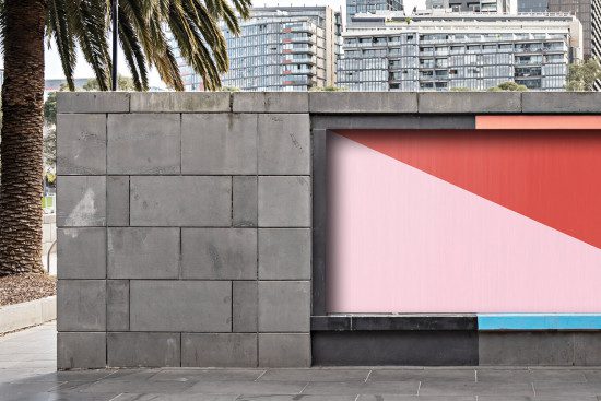 Urban billboard mockup with pink and red design space on a concrete wall, outdoor advertising template, modern city background.