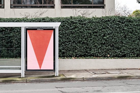 Bus stop billboard mockup with large red advertising space, urban setting for presentation, cityscape design template.