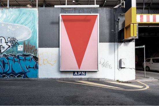 Urban billboard mockup on a concrete wall with graffiti, street view, suitable for poster design presentation and advertising concepts.