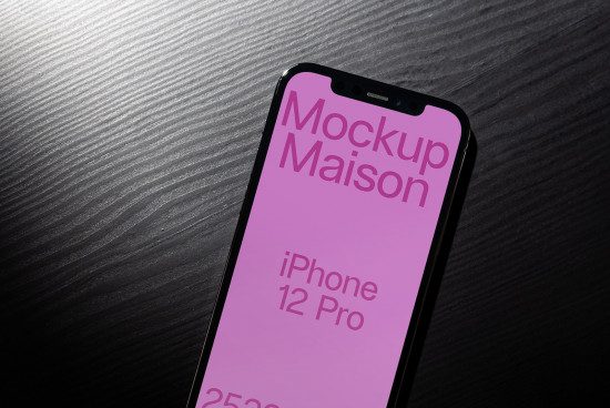 iPhone 12 Pro mockup on dark textured surface, showcasing screen design, ideal for presentations, digital asset for designers.