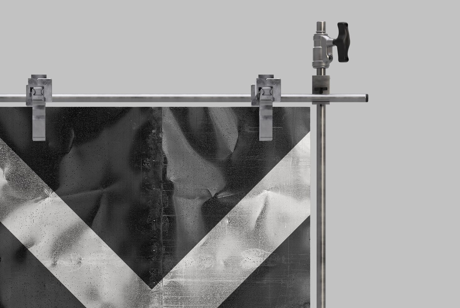 Monochrome fabric texture poster mockup with metal clamps and holder rail for graphic design presentations and portfolio display.