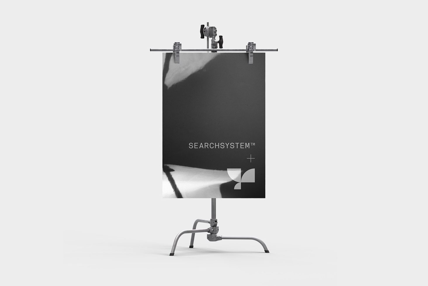 Modern easel display mockup with a grayscale poster featuring minimalist design in a studio setting, ideal for presentations and portfolios.