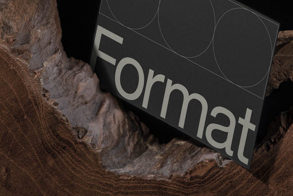 Elegant business card mockup with a modern font, contrasting textures of paper and wood, ideal for showcasing design professional branding materials.