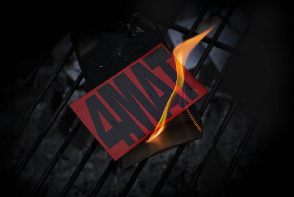 Dark dramatic mockup of a burning card with red bold text on metal grate, suitable for graphic presentations and design elements.