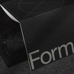 Elegant black folder mockup with white text, modern design, positioned on a textured dark surface, ideal for presenting corporate identity graphics.