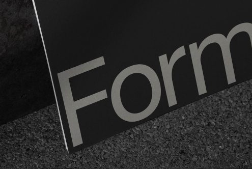 Close-up of elegant font design with the word Form on textured paper, ideal for graphic design mockups and typography inspiration.