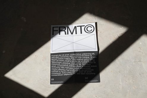 Elegant paper mockup with shadow overlay, ideal for presenting branding designs, fonts, or graphics, laid on a textured concrete surface.