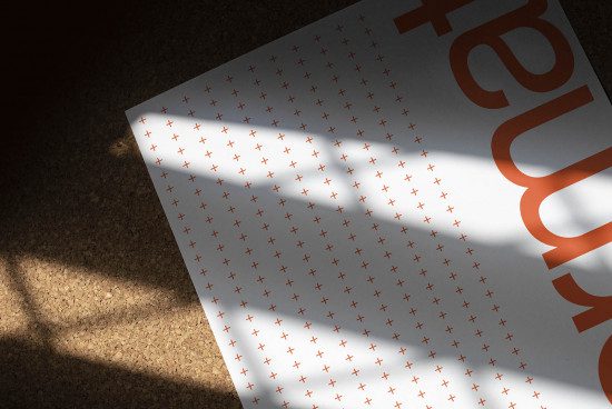 High-quality paper mockup with artistic shadows, showcasing font design or graphic patterns on textured surface, ideal for presentations and portfolios.