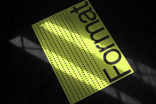 Yellow poster mockup with halftone design and dramatic lighting effect on dark background, ideal for presentations and advertising.