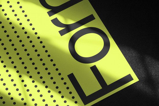 Yellow poster mockup with black dots and typography showcasing modern design, graphic print, creative presentation for designers and advertising.