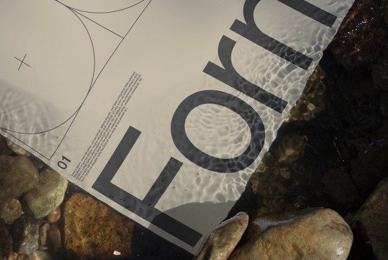 Printed paper mockup partially submerged in water with clear typography design, creating a realistic texture effect perfect for designers.