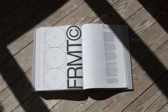 Open magazine mockup on wooden floor with natural shadows, showcasing modern typography and layout design.