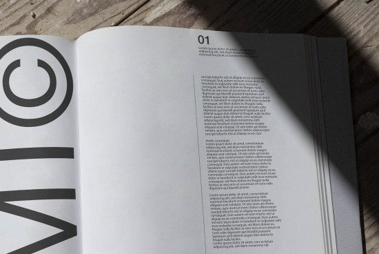 Open magazine mockup on wooden surface displaying article layout with bold typography for graphic design and publishing visual assets.