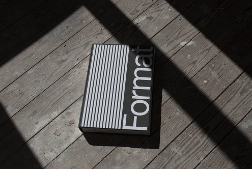 Elegant book cover mockup on wooden floor with natural shadows, showcasing modern typography and minimal design, ideal for presentation.