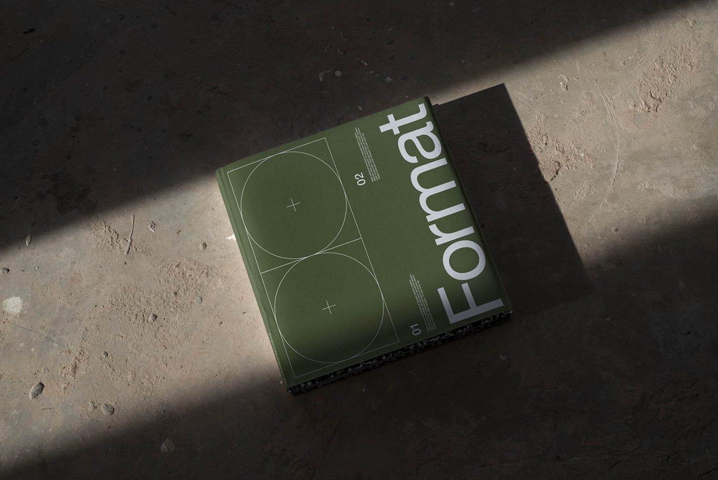 Magazine mockup on a textured surface with natural lighting highlighting clean design and typography, ideal for presentations and portfolio showcases.