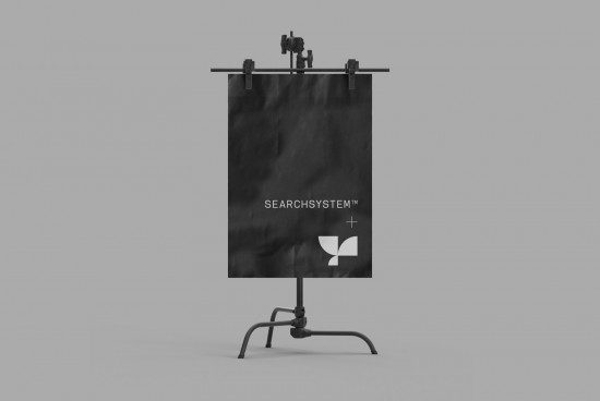 Easel mockup displaying black poster with minimalist logo, ideal for designers to showcase branding graphics in a professional setting.