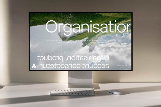 Modern computer monitor displaying typography design template with nature background, elegant workspace setup for graphic design.