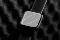 Smartwatch on wrist with gray screen mockup on textured fabric