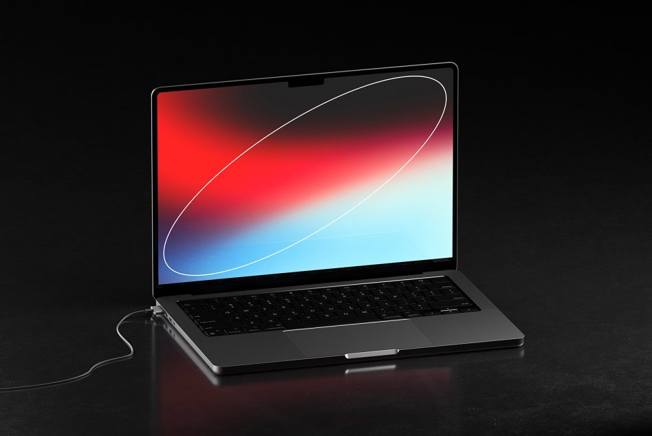 Laptop tilted showing red to blue gradient screen with flowing white lines