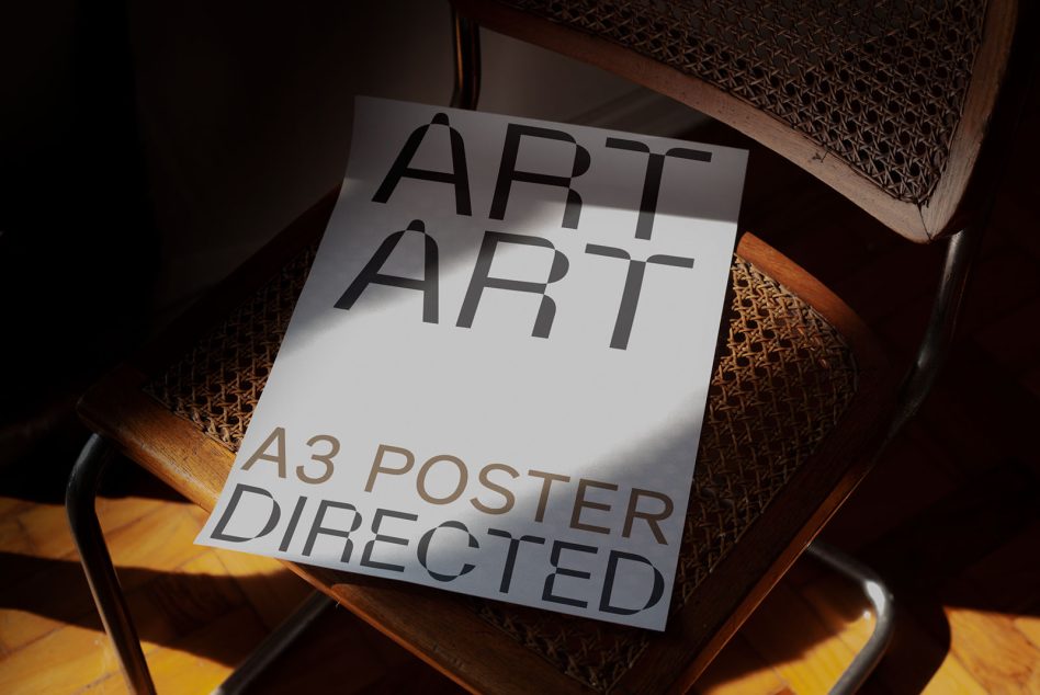 A3 poster mockup showing Art Directed typography on textured chair backdrop