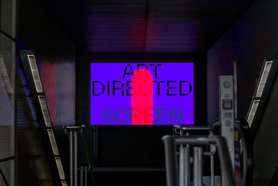 High-quality mockup showing a screen with 'ART DIRECTED SCREEN' text in a modern studio setup, perfect for presenting creative designs and digital art.