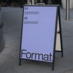 Outdoor signage mockup displayed on an A-frame stand with editable design space for graphic designers to showcase work.