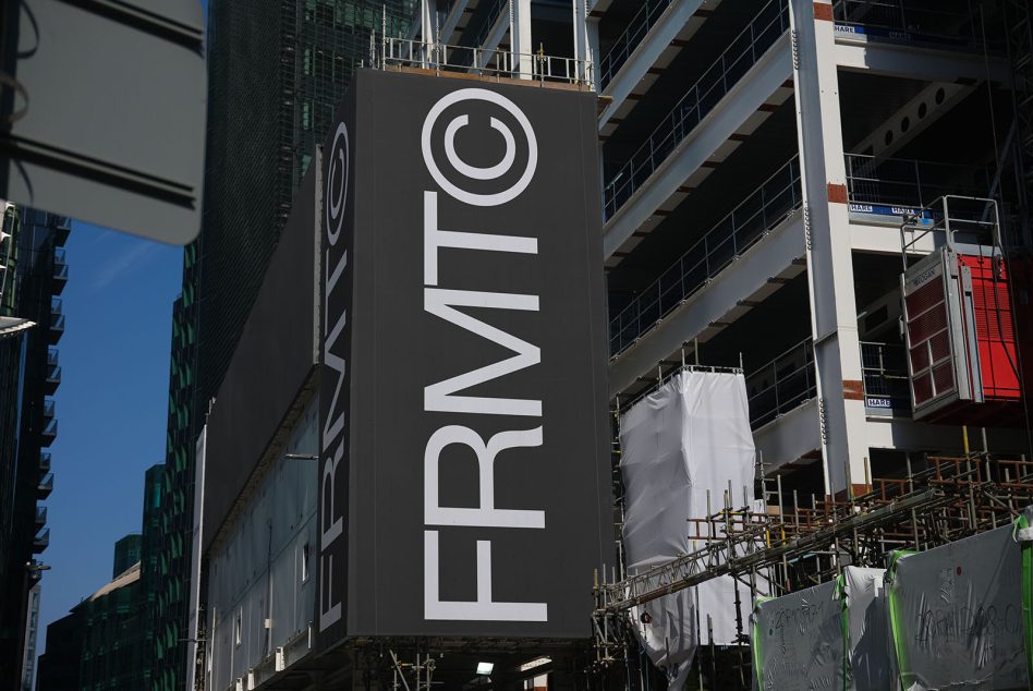 Urban construction site with bold typography on signage, exemplifying large format font design and architectural mockup techniques.