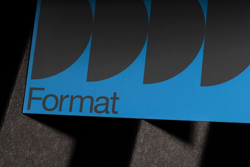 Format branded blue card with geometric wave pattern on textured dark background