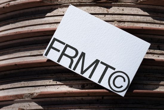 Business card mockup on terracotta tile background, showcasing logo design, perfect for designers creating branding assets.