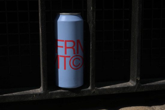 Blue soda can with red logo mockup, realistic product packaging design, beverage branding presentation, graphic design asset.