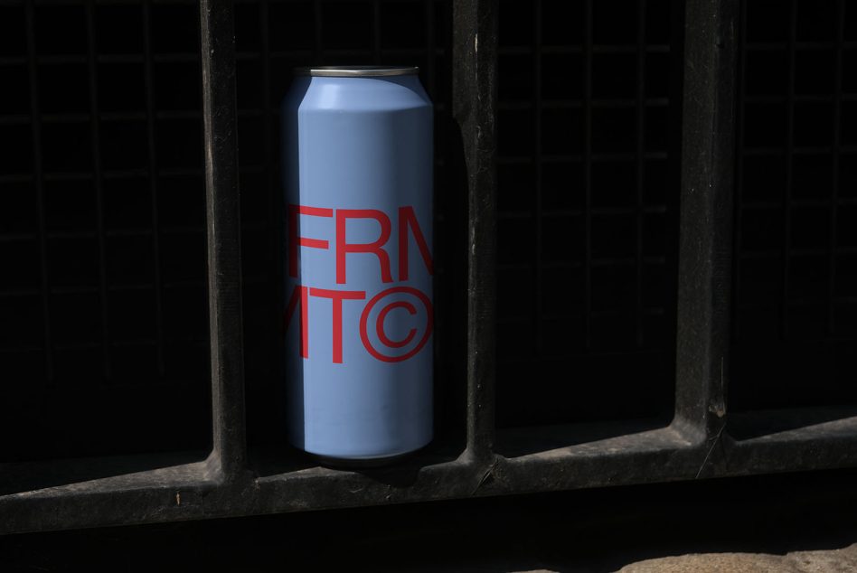Tall slim can labeled FRNTIC in red on blue background between black bars