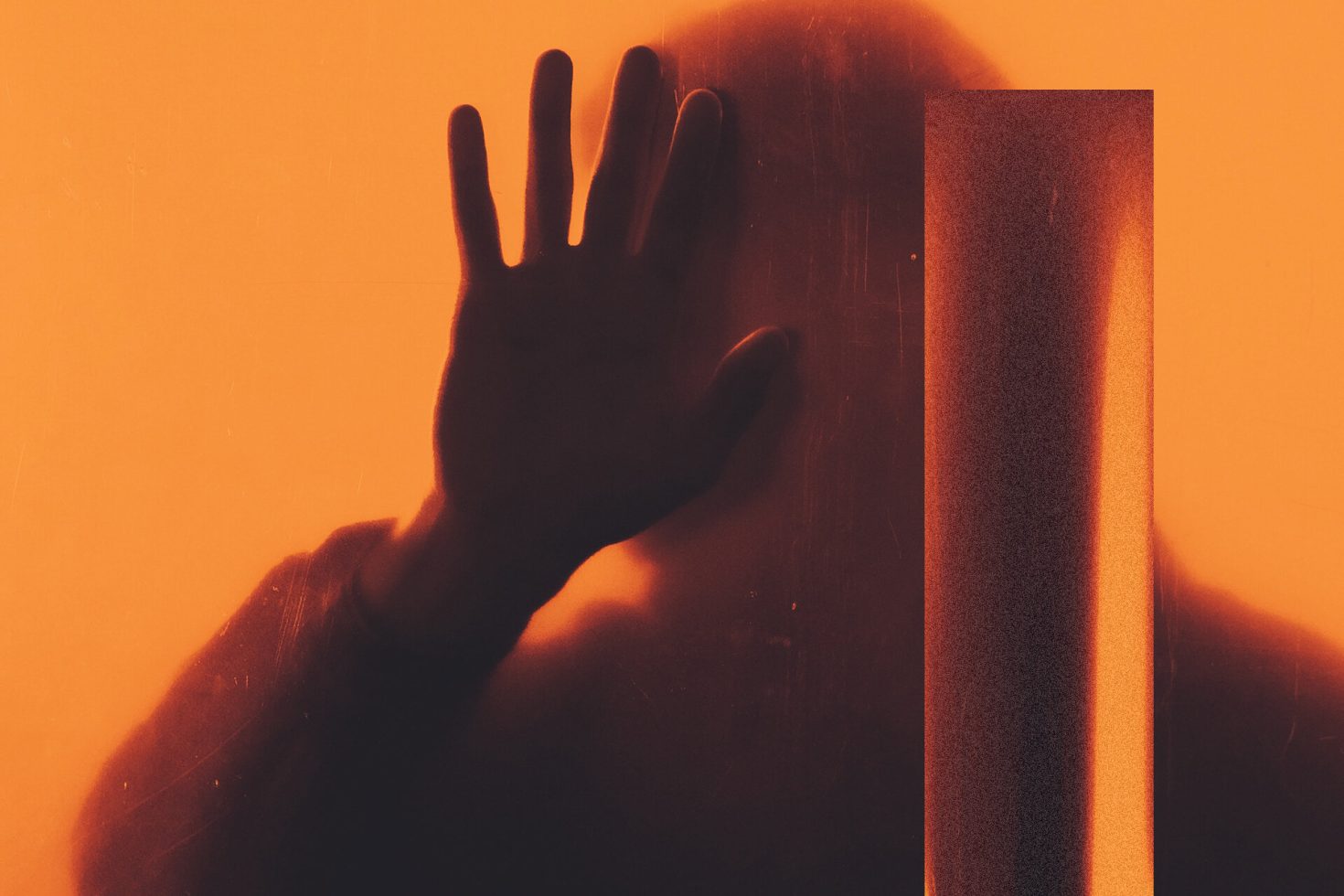 Silhouetted hand against orange backdrop, mysterious shadow play, abstract design element, moody lighting, versatile graphic for creative projects.