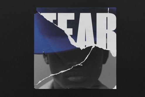 Torn paper graphic design with bold typography "FEAR" over a monochrome portrait, conveying emotion, suitable for mockup, font, and template design.