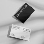 Elegant black and white business card mockup on a textured background, showcasing modern typography and design layout, ideal for presentations.