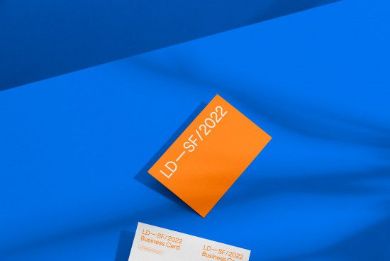 Vibrant business card mockup on blue background, showcasing font design and layout, ideal for designers and print templates.