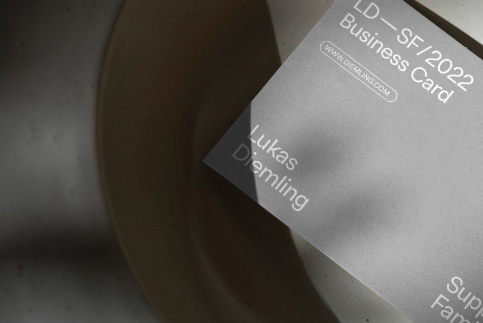 Elegant business card mockup on a ceramic plate creating a shadow, with modern typography, perfect for designers' branding projects.