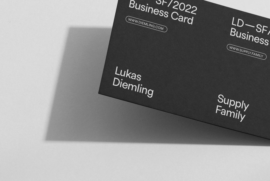 Elegant black business card mockup on light background highlighting minimalist design, clean typeface, and modern aesthetics for designers.