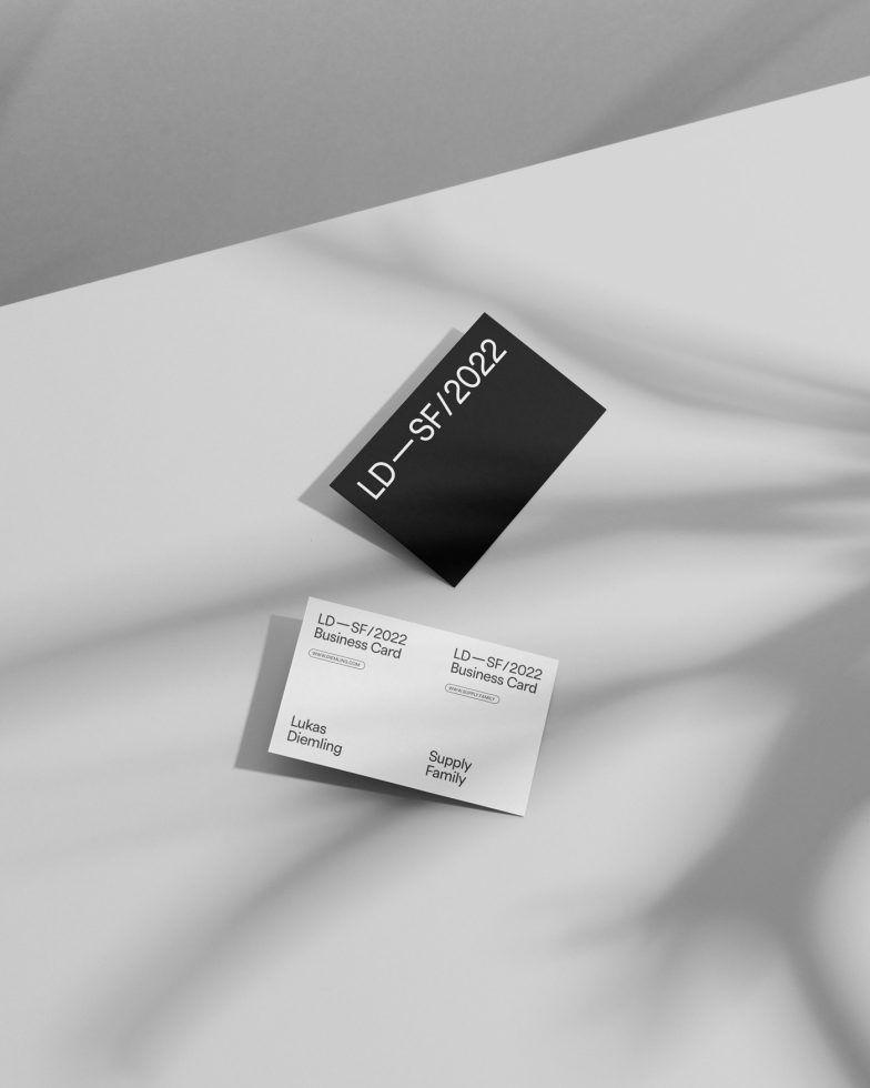 Elegant black and white business card mockup on textured background, modern design, professional corporate template, creative presentation.