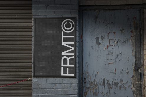 Urban signage mockup on gritty textured wall and door, ideal for presenting logo designs and branding in realistic settings for designers.