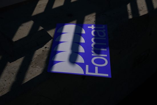 Mockup of a poster with dynamic shadows on concrete, showcasing design presentation, suitable for graphic display in portfolios.