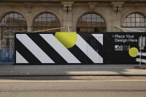 Street billboard on historic building, diagonal stripes with yellow circle, right side text placement