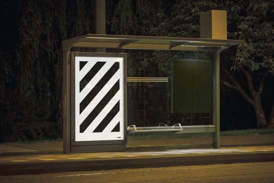 Nighttime bus stop with illuminated blank billboard mockup, urban setting, ready for advertising design, clear poster space.