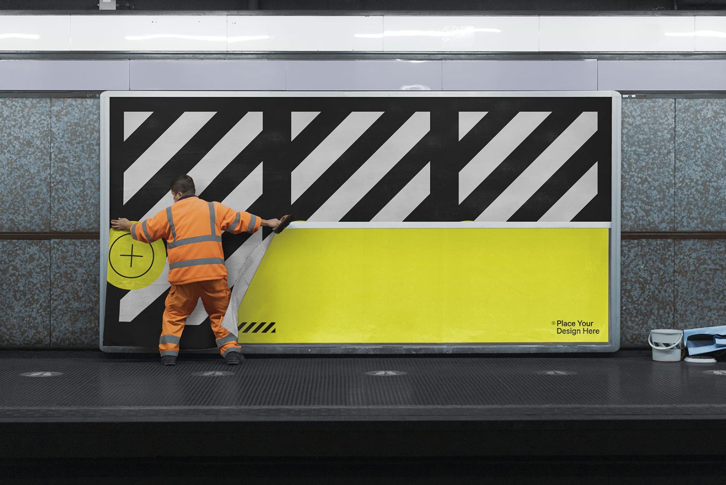 Worker pasting a mockup poster on subway station billboard for urban advertising design templates.