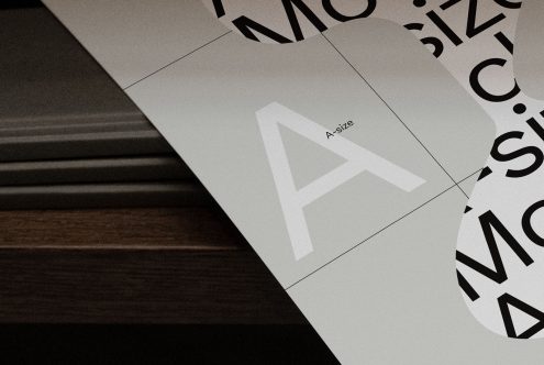 Elegant typeface showcased in print mockup with varying letter sizes on paper, ideal for font designers and typographic presentations.