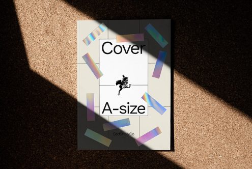 A-size magazine cover mockup with holographic elements design layout in natural light on cork background for presentation.