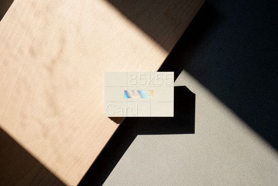 Business card mockup on a two-tone surface with natural shadow, ideal for presentation and branding design for designers.