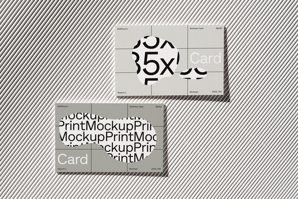 Stacked business card mockups on white background with bold numbers showing through